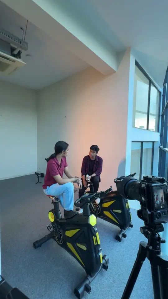 A camera framing two performers during a CineByte indoor shoot